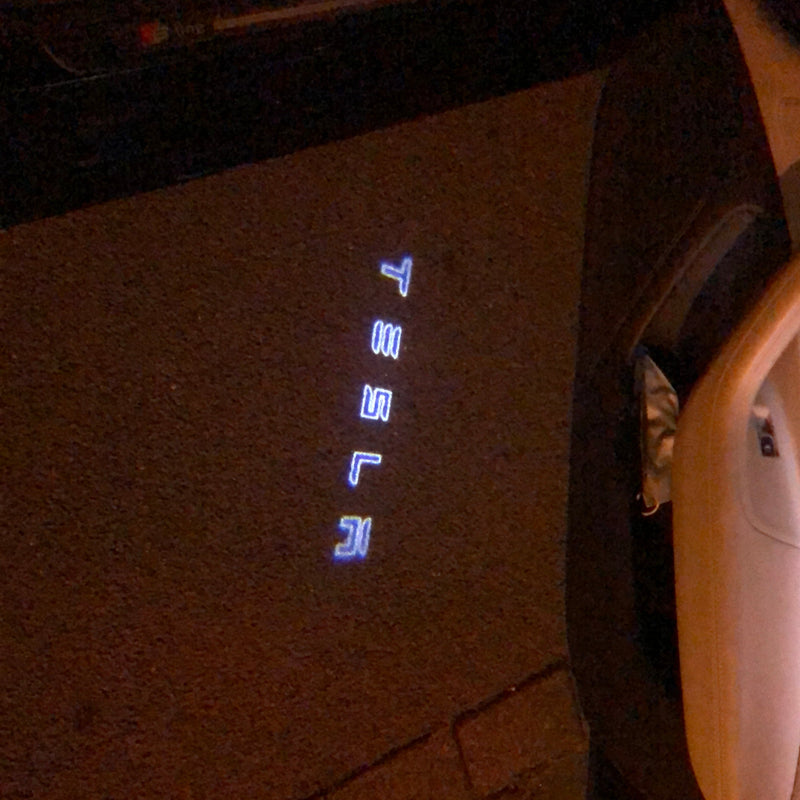 TESLA LOGO PROJECROTR LIGHTS Nr.1502 (quantity  1 =  2 Logo Film /  2 door lights)