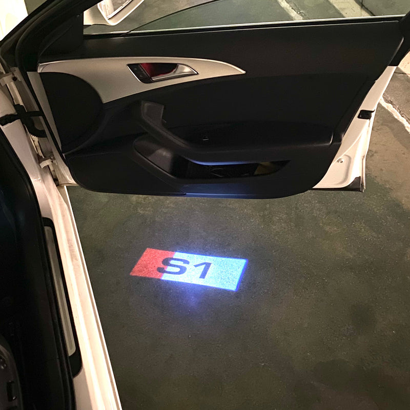 AUDI S1  LOGO PROJECTOT LIGHTS Nr.127  (quantity 1 = 2 Logo Films /2 door lights）