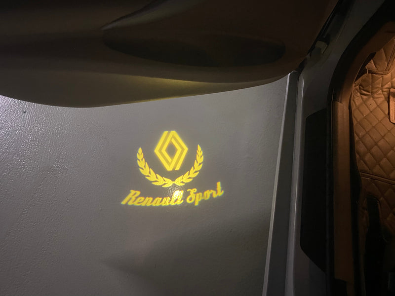 RENAULT ORIGINAL LOGO PROJECTOT LIGHTS Nr.28087(quantity 1 = 2 Logo Films /2 door lights )