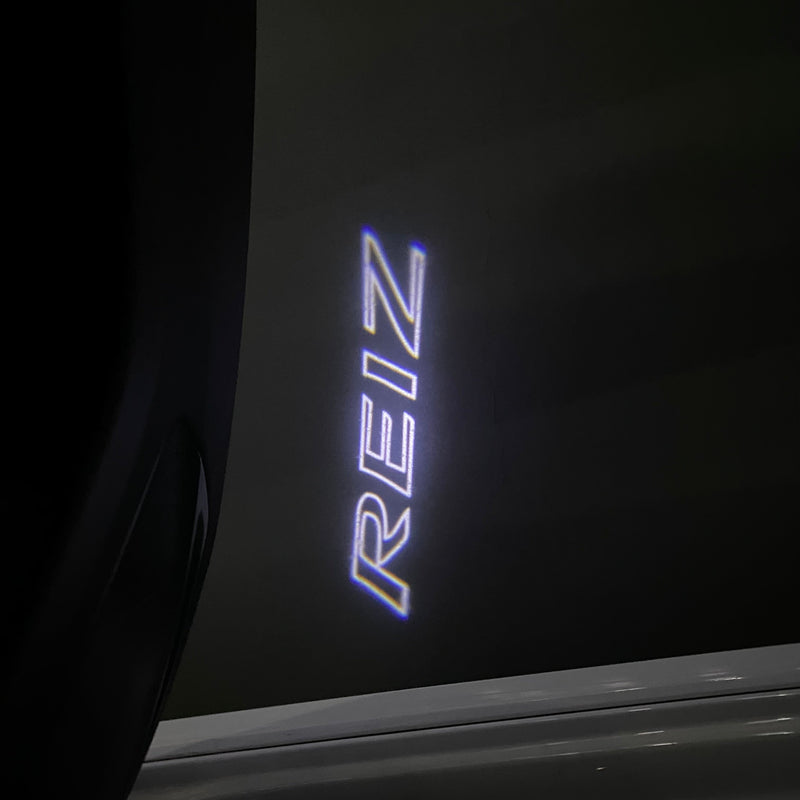 Toyota  REIZ LOGO PROJECROTR LIGHTS Nr.02 (quantity 1 = 1 sets/2 door lights)T50