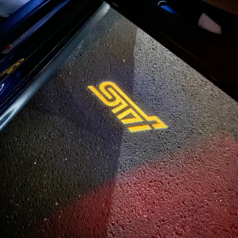 SUBARU STI  LOGO PROJECROTR LIGHTS Nr.03 (quantity 1 = 1 sets/2 door lights)