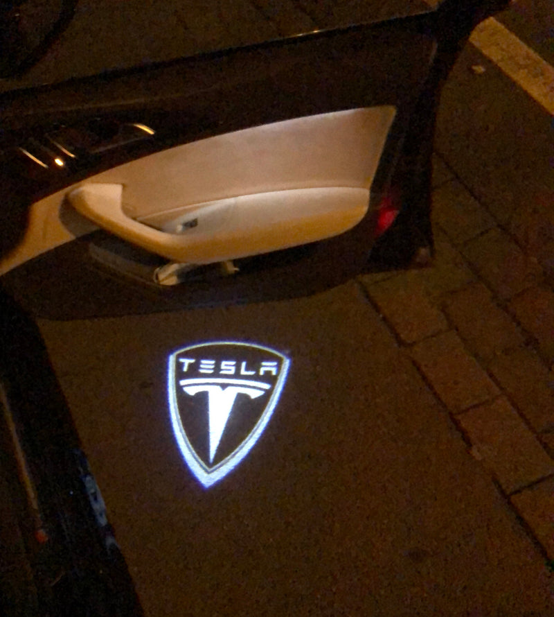 TESLA LOGO PROJECROTR LIGHTS Nr.1506 (quantity  1 =  2 Logo Film /  2 door lights)