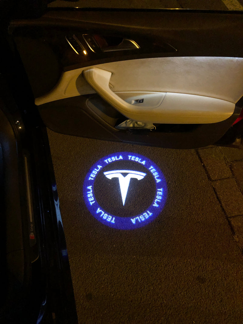 TESLA LOGO PROJECROTR LIGHTS Nr.1511 (quantity  1 =  2 Logo Film /  2 door lights)