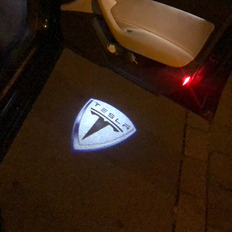 TESLA LOGO PROJECROTR LIGHTS Nr.1505 (quantity  1 =  2 Logo Film /  2 door lights)