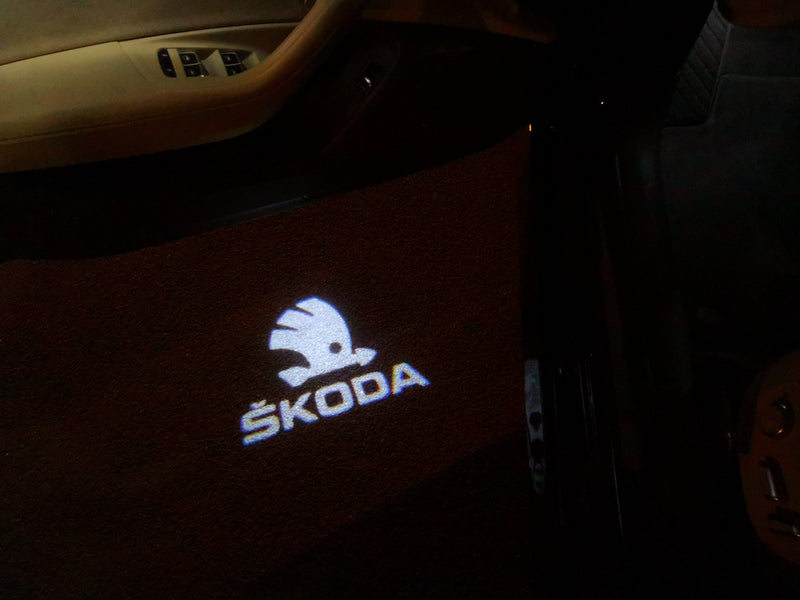 SKODA ORIGINAL LOGO PROJECTOT LIGHTS Nr.10 (quantity  1 =  2 Logo Film /  2 door lights)