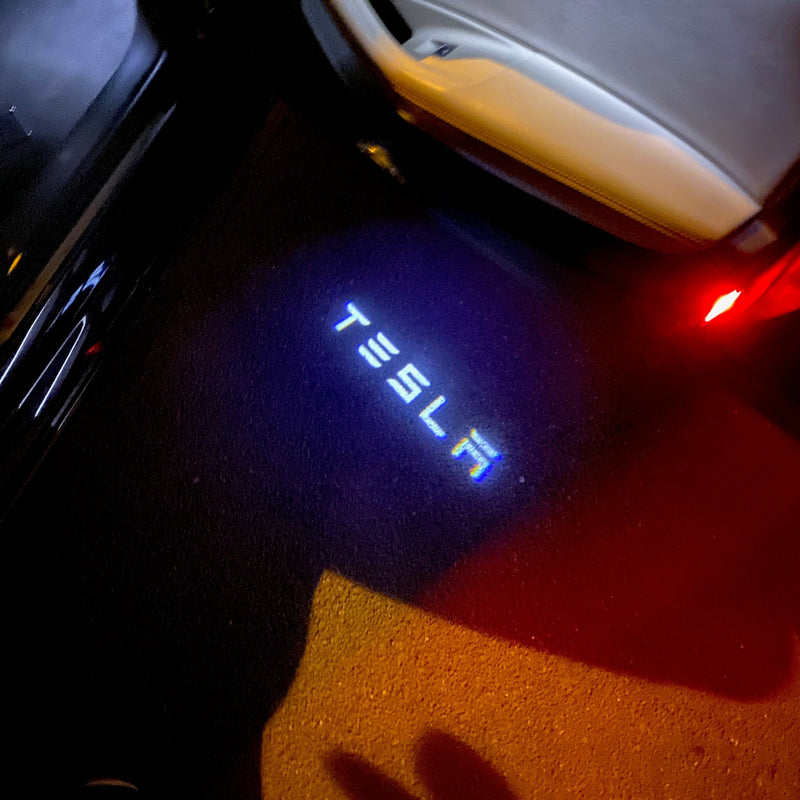 TESLA LOGO PROJECROTR LIGHTS Nr.1503 (quantity  1 =  2 Logo Film /  2 door lights)