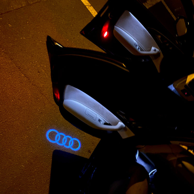 AUDI 4 RINGS LOGO PROJECTOT LIGHTS Nr.08  (quantity 1 = 2 Logo Films /2 door lights）