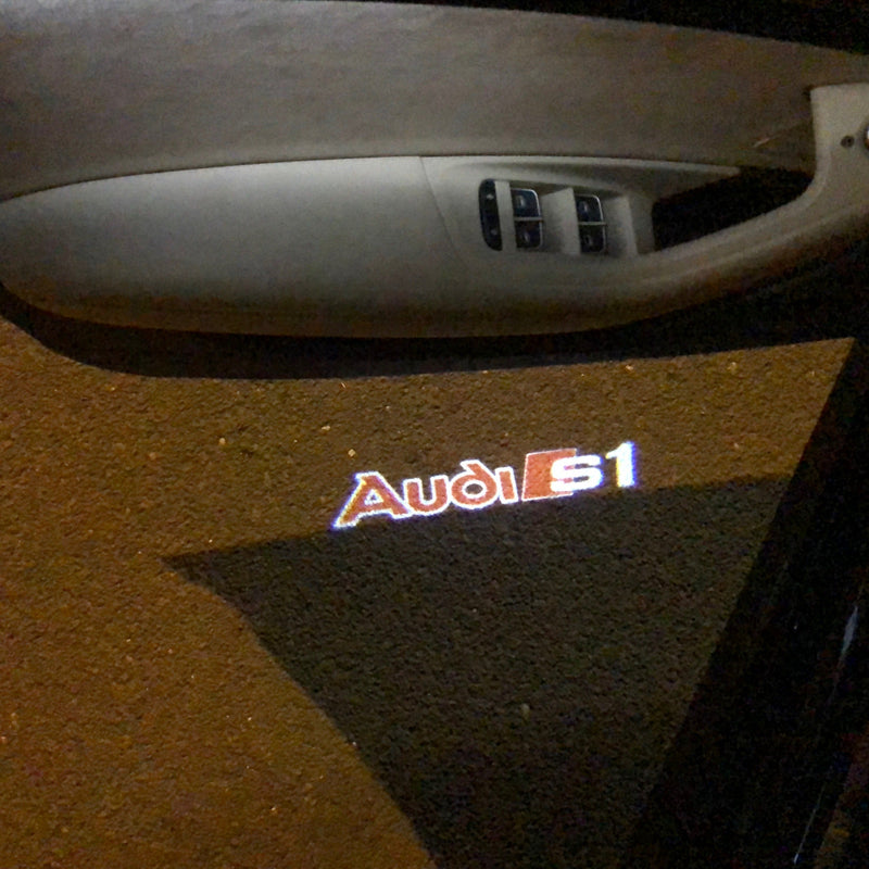 AUDI S1  LOGO PROJECTOT LIGHTS Nr.96   (quantity 1 = 2 Logo Films /2 door lights）