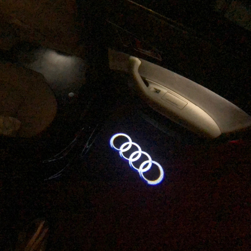 AUDI 4 RINGS LOGO PROJECTOT LIGHTS Nr.04  (quantity 1 = 2 Logo Films /2 door lights）