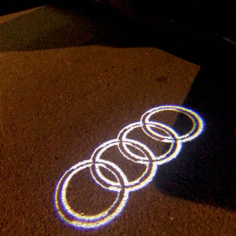 AUDI 4 RINGS LOGO PROJECTOT LIGHTS Nr.09  (quantity 1 = 2 Logo Films /2 door lights）