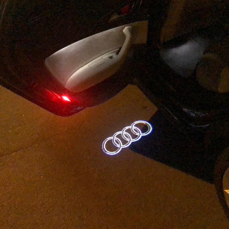 AUDI 4 RINGS LOGO PROJECTOT LIGHTS Nr.09  (quantity 1 = 2 Logo Films /2 door lights）